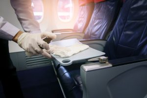 Airlines are cleaning high touch cabin surfaces, like tray tables, more frequently due to COVID 19